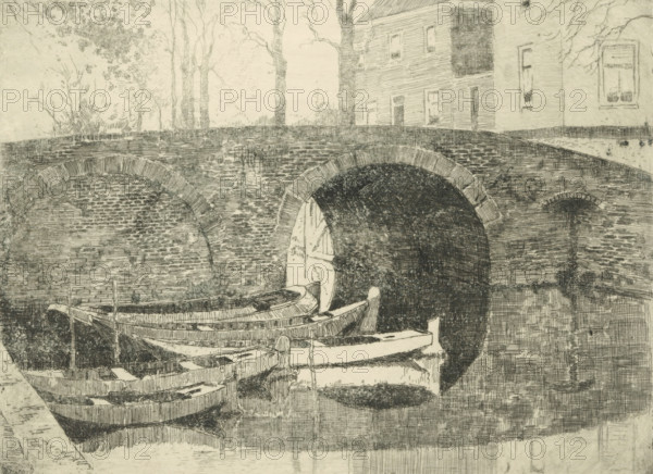 Bridge over a canal, print, Five rowing boats in the water on the left., printmaker: Cornelis Vreedenburgh, 1914, paper, etching, drypoint, intaglio printmaking technique, height 147 mm x width 199 mm, rowing-boat, canoe, bridge in city across river, canal, A monochrome sketch showing a stone arched bridge spanning over a dark tunnel opening, with textured brickwork visible on the bridge and tunnel interior. Several small wooden rowboats are moored in the water beneath the bridge, their curved hulls and planks rendered with fine lines and crosshatching. On the far side of the bridge a building with vertical siding and rectangular windows stands, and tall, leafed trees rise behind the bridge with slender trunks and foliage. The water reflects parts of the boats and bridge, and the overall image is detailed with varied line work and shading.