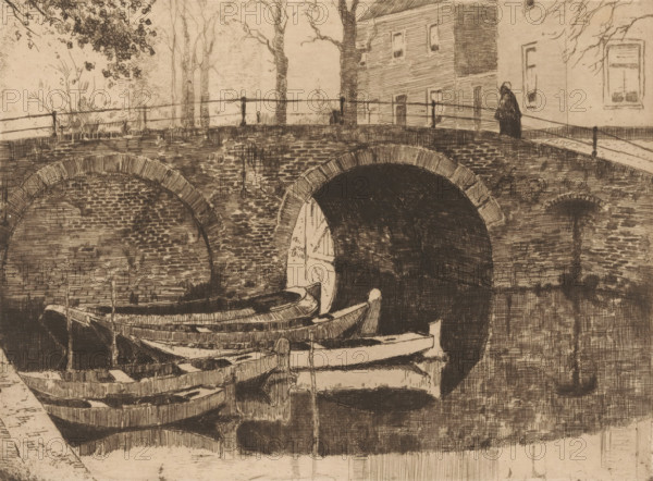 Bridge over a canal, print, Five rowing boats in the water on the left., printmaker: Cornelis Vreedenburgh (signed by artist), 1914, paper, etching, drypoint, intaglio printmaking technique, height 147 mm x width 199 mm, rowing-boat, canoe, bridge in city across river, canal, A monochrome etching showing a brick arch bridge spanning a waterway with the dark opening of a tunnel beneath one arch and a shallower arch visible beside it, wooden rowboats moored in the foreground with visible planks and oars, a stone or paved edge along the near side, a railing running along the top of the bridge, bare trees and foliage rising behind the bridge, a multi-story building with several windows adjacent to the bridge, and a solitary figure standing on the bridge near the building.