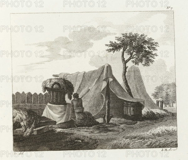 Man sitting next to a full basket near a tent, Drawing examples, second notebook, 2me. cahier d'études, print, album page, Series number, 7, This print is part of an album., after drawing by Dubois, supervision: Jacques Marchand, publisher: Basset, Paris, c. 1800 - c. 1825, Dubois, Jacques Marchand, Basset, printmaker, after drawing by, supervision, publisher, paper, etching, engraving, stippelwerk, crayon manner, height 165 mm x width 194 mm, container made of plant material other than wood: basket, tent, A stippled ink scene shows a makeshift campsite with a draped tent held up by a slender tree with leafy branches, a basket filled with foliage set on a cloth-covered table, and a figure kneeling beside the table reaching toward the tent. In front of the tent a wooden barrel and a low round container sit on the ground, and a picket fence runs along the left background. The sky is filled with soft, dotted cloud forms and the foreground ground is textured with short strokes and stipplin...
