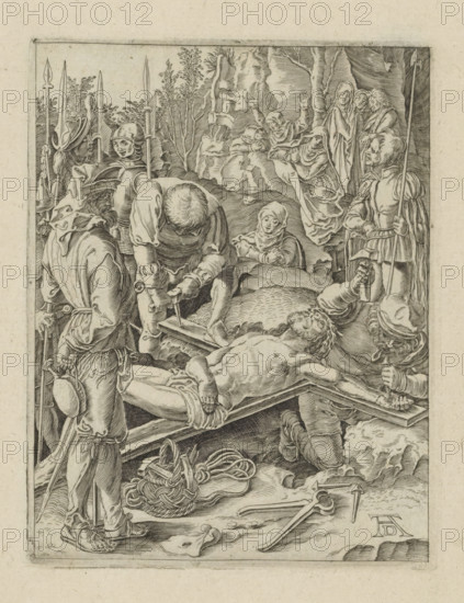 Christ nailed to the cross, Passio Christi Ab Alberto Durer Nurenburgensi Effigiata, The Little Passion, print, album page, Christ is nailed to the cross. Print is part of an album., printmaker, after print by, publisher, The Hague, paper, engraving, engraving pasted onto album page, height 131 mm x width 100 mm, the erection of the cross: Christ is nailed to the cross which lies on the ground, A detailed black and white engraving shows a group of armored soldiers and robed figures surrounding a reclining, partially nude man on a wooden bed or bier, with one soldier kneeling and using a tool near the man's torso while another holds a hammer and nail above the foot area. The foreground contains coiled rope, a hat on the ground, scattered tools, and a soldier standing with a pole weapon and a small round canteen at his side. Behind the central scene there are trees and draped cloth, and several women in flowing robes display varied gestures and facial expressions as they look toward the ...
