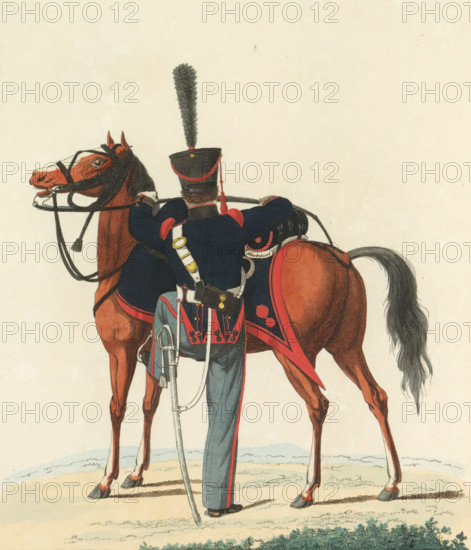 Gunner, on horseback, in large outfit, Riding Artillery, print, A Dutch gunner of the riding artillery, in large outfit. Plate 27. Uniform representation in 'Description of the Royal Dutch Troops' by JF Teupken, 1823., printmaker:, Netherlands, after drawing by J. en VH, publisher: Jan Frederik Teupken, publisher: Gebroeders van Cleef, printer (person): Giunta d'Albani, Gebroeders, The Hague, 1823, J. en VH, Jan Frederik Teupken, Gebroeders van Cleef, Giunta d'Albani, printmaker, printer (person), paper, etching, engraving, hand coloring, etching and engraving, hand colored, height 300 mm x width 205 mm, (military) uniforms, uniform, Period, 1820 - 1823, A rear view of a mounted cavalryman standing beside a chestnut horse, showing the soldier's dark blue uniform with red trim and shoulder accents, a tall shako hat topped with a long feather plume, a white crossbelt with brass fittings, a sabre suspended at his side, and a decorated saddlecloth on the horse; the horse wears a bridle and...