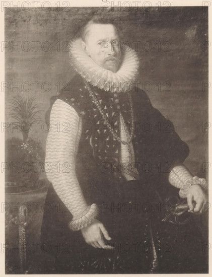 Photo reproduction of a painted portrait of Albert VII, Archduke of Austria, reproduction, photomechanical print, number: '77', cliché maker: anonymous, after painting by Peter Paul Rubens (workshop of), 1870 - 1903, photographer, paper, collotype, letterpress printing, light printing and text in letterpress, height 189 mm x width 147 mm, Person, Albrecht Archduke of Austria, historical persons, knighthood order of the Golden Fleece - insignia of a knighthood order, eg: badge, chain (with NAME of order), A monochrome portrait of a man shown from the chest down to his hands, wearing a dark ornate garment with a patterned vest and a large pleated ruff collar around his neck, pale textured sleeves with frilled cuffs, and a long decorative chain draped across his chest; his right hand rests at his side while his left hand holds the hilt of a sword, and a potted plant with long leaves appears behind him on the left side.