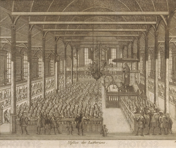 The Lutheran church in Leiden seen from the inside, L'eglise des Lutheriens, print, book illustration, The Lutheran church in Leiden seen from the inside. Numbered bottom right: 21., publisher: Pieter van der Aa (I) (possibly), Leiden, 1712, Pieter van der Aa (I), printmaker, publisher, paper, engraving, etching, height 139 mm x width 169 mm, Print also used in: Les delices de Leide, une des célébres villes de l'Europe, according to the exact description of the son's antiquity, his diverse aggrandissemens, his academy, his manufactures, his curiosities, Leiden: Pieter van der Aa, 1712., interior of church, Protestant Churches and denominations (LUTHERANS), Lutherse kerk (Leiden), A detailed monochrome engraving of a large interior space with tall columns supporting a vaulted ceiling and horizontal beams, rows of arched windows along the side walls, multiple tiers of wooden balconies with railings, and a central aisle flanked by densely packed seated figures. A large ornate chandelier h...