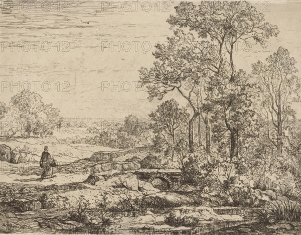 Looded landscape with woman near a bridge, print, printmaker: Hector Allemand, France, 1866, paper, etching, drypoint, intaglio printmaking technique, drypoint and plate tone on gray paper, height 222 mm x width 273 mm, In the literature this print is referred to as 'Petit Pont de pierre à Crémieu'., landscapes with waters, waterscapes, seascapes (in the temperate zone), bridge, walking - AA - female human figure, Crémieu, A detailed pen-and-ink landscape shows a rocky foreground with textured ground and low vegetation, a small stone arch or culvert set into a bank, and a path leading away from the viewer. To the left a solitary figure stands facing the distance, wearing a long garment and carrying a bundle. The middle ground opens to a flat plain with scattered low trees and shrubs, while the right side is dominated by tall, slender trees with intricate branching and clustered foliage. The sky above is rendered with fine horizontal lines and sparse, linear cloud forms. The overall sce...