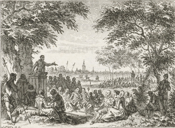 Public sermon in the field, 1566, print, historical print, 1566. Hedge sermon outside the city: a preacher speaking under a tree, listeners sitting on the ground., printmaker: Simon Fokke, Northern Netherlands, after design by, 1782 - 1784, paper, etching, height 84 mm x width 106 mm, Stands before the letter., sermon, Protestant service, Eighty Years' War, Reformation, Hedge sermons, Period, A detailed black and white etching shows a large outdoor gathering beneath leafy trees, with a crowd of seated and standing figures in period clothing facing a raised platform where a man gestures from a pulpit. In the foreground, several seated figures recline or turn toward the speaker, and groups of people cluster along the shore. In the middle distance, many small figures stand in shallow water and along the bank, some holding long poles. Trees with textured trunks and dense canopies frame both sides of the scene, and a distant city skyline with a tall spire appears on the horizon across the w...