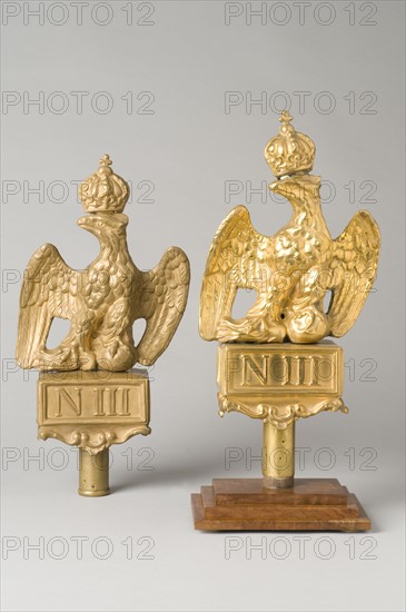 2 crowned eagles, in chased brass