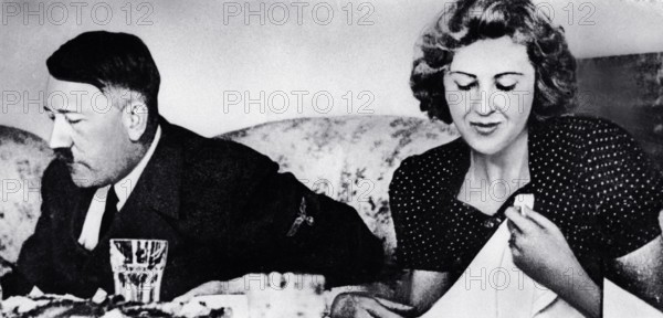 German dictator Adolf Hitler and his mistress Eva Braun dine in a still from a private home movie made by Braun s siste