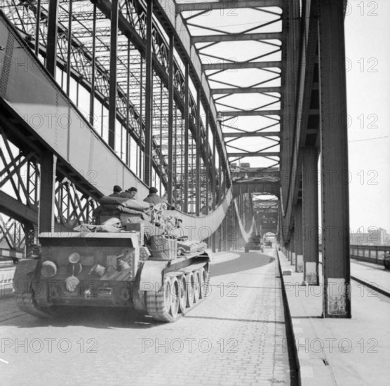 The British Army in North-west Europe 1944-45 Cromwell tanks of 7th Armoured Division pass over a bridge in Hamburg, 4 M