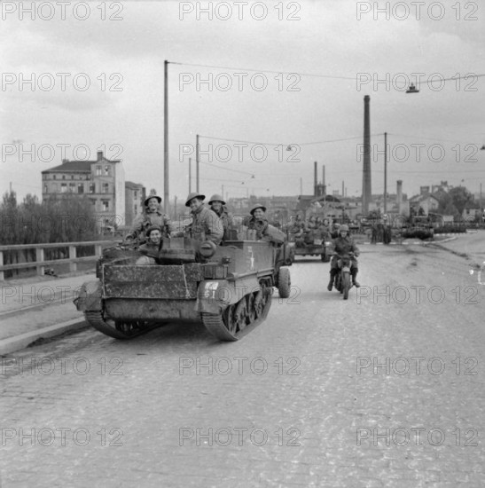 The British Army in North-west Europe 1944-45 Universal carriers of 7th Armoured Division in Hamburg, 3 May 1945. Copyri