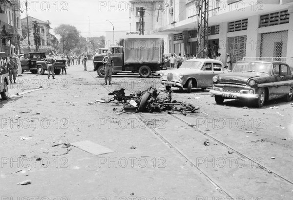 Vietnam: Aftermath of a street bombing attributed to the NLF (Viet Cong) in Saigon, c. 1965. The Second Indochina War, k