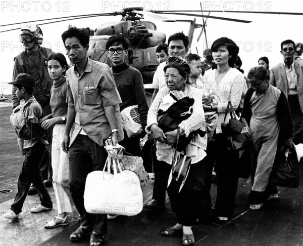 Vietnam: Vietnamese refugees evacuated by helicopter arriving aboard the USS Midway, Fall of Saigon, 29 April 1975 The F