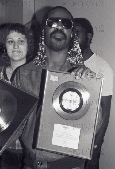 Stevie Wonder London, UK. LIBRARY. Stevie Wonder is presented a silver disc to celebrate sales of 250,000 in the UK for