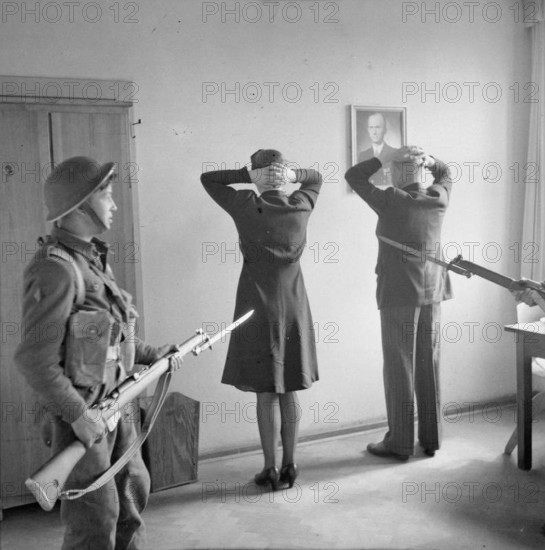 Germany Under Allied Occupation Prisoners under guard during the operation to arrest members of the German Government ca