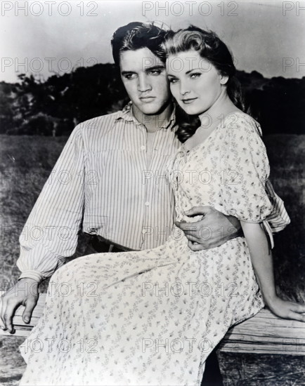 Photograph of Elvis and Priscilla Presley while on the set of Love me Tender . Elvis Presley (1935-1977) an American sin