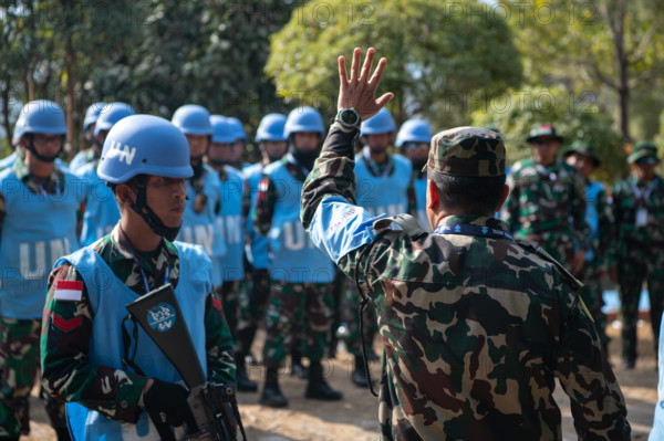 RECORD DATE NOT STATED A Nepali solider, serving as a field training exercise instructor, advises Indonesian National A