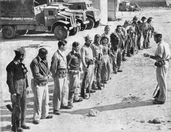 Israel / Palestine: Soldiers of the Israeli Palmach (Negev Brigade) receive orders before participating in Operation Yoa