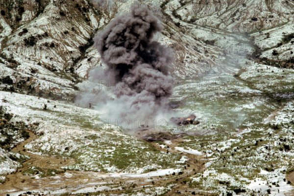 RECORD DATE NOT STATED Smoke and dust rise into the air as several bombs dropped by a Navy aircraft explode in the impac