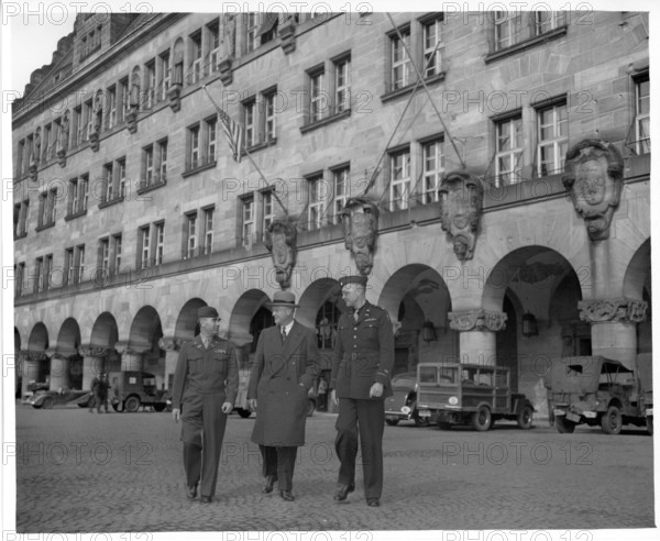 RECORD DATE NOT STATED  Original Caption: Shown leaving the Palace of Justice at Nurenburg, are left to right: Col. Char