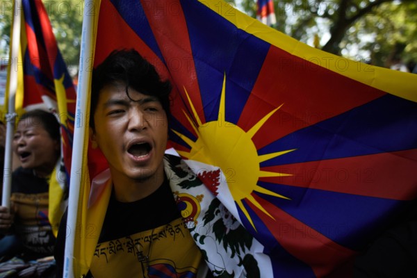 NEW DELHI INDIA MARCH 10 Exiled Tibetans shout slogans as they participate in a protest to mark