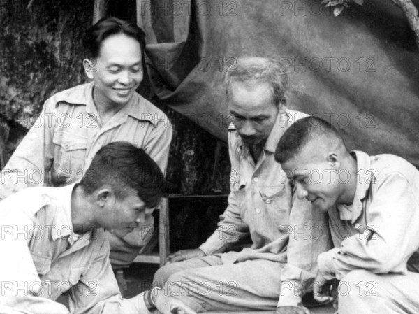 Vietnam: General Vo Nguyen Giap (back left) with President Ho Chi Minh (second from right) and other advisers during the