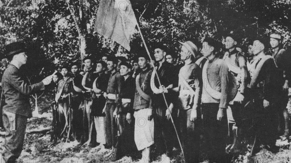 Vietnam: Vo Nguyen Giap addresses a small group of nascent Viet Miinh forces somewhere in Viet Bac c. 1942 Vi?t Minh (