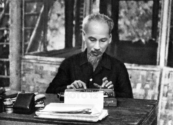 Vietnam: President Ho Chi Minh (1890-1969) seated at his typewriter, c. 1950 Há» Chi Minh, born Nguyá»Ön Sinh Cung and a