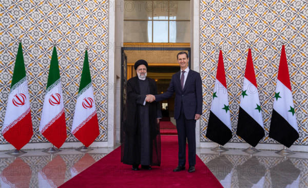 Syrian President Bashar al-Assad receives the Iranian President Ebrahim Raisi at the presidential palace