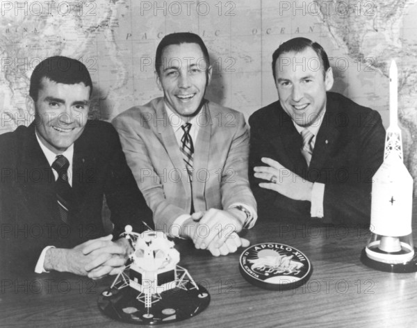 Apollo 13 astronauts Fred Haise, John Swigert, and James Lovell are pictured during the press conference after their ill