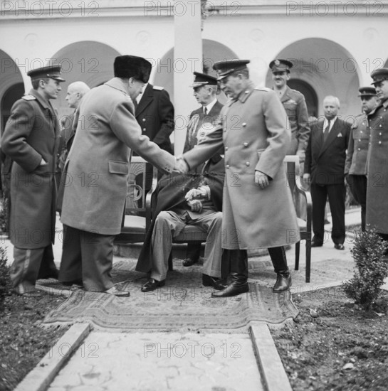 Winston Churchill greets Joseph Stalin with President Roosevelt outside the Livadia Palace during the Yalta Conference,