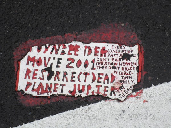 Toynbee tiles A Toynbee Tile is seen embedded into the pavement at a site in the Chelsea neighborhoo