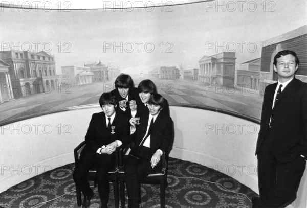 Beatles Paul McCartney, George Harrison, John Lennon, Ringo Starr and their manager Brian Epstein after being presented