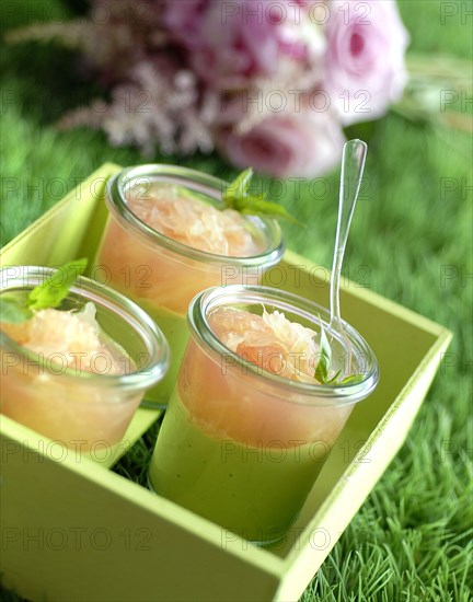 Meal in pink and green theme: cream of avocado and pink grapefruit