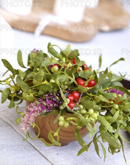 Typical French buffet: small bunch of mistletoe and berries