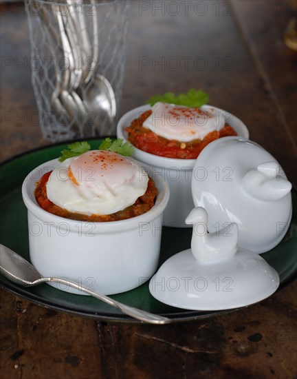 Eggs for dinner: sweet cooked vegetables with poached egg