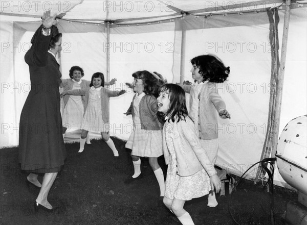 Prime Minister Margaret Thatcher seen here leading a group of children in a session of physical exercise designed to beat the winter chill at Winifred School, Stockport. December 1981 P003361