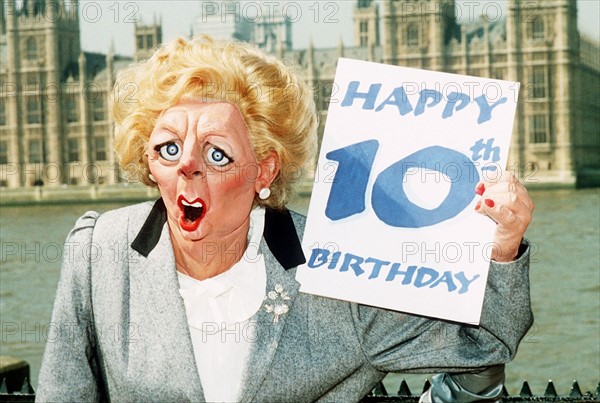Margaret Thatcher MP Puppet  holding up 10th Happy Birthday card. 1989