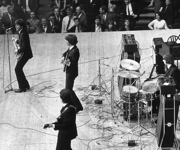 The Beatles on stage at the Palais des Sport in Paris.
June 1964.