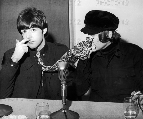 The Beatles Paul McCartney and John Lennon pictured at a backstage news press conference at the Odeon in Glasgow 3rd December 1965.

Pictured at start of The Beatles 1965 UK Tour, their final UK Tour, also release date of album 'Rubber Soul'.