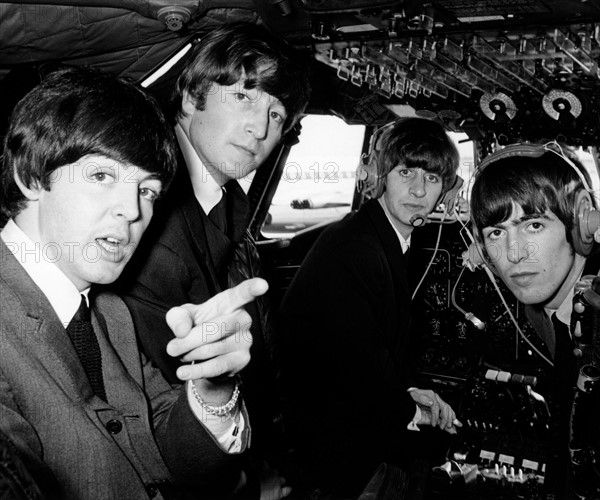 Beatles pop band in the cockpit of an aircraft on the way to the Northern Premiere of a 'Hard day's Night' in Liverpool.
13th July 1965 
 *** Local Caption *** rescan -  - 28/04/2010