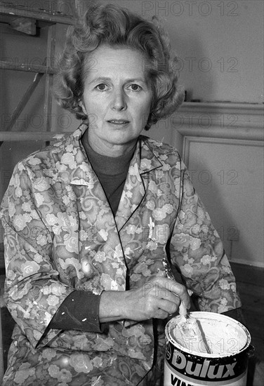 Margaret Thatcher spent the weekend in the country with her husband Dennis decorating their new country Belfry Flat at Scotney Castle, Lamberhurst, near Tunbridge Wells,Kent.
December 1975 
Dressed for the occasionin a matching green jumper and skirt with a printed overall she wielded a paintbrush like a profesional.
She explained that it would have cost £75.00 per room to have the decorators in, and reminded us that Churchill had once built a wall.