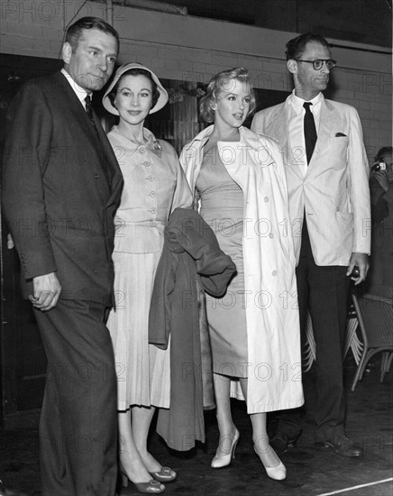 Actress Marilyn Monroe pictured with her playwright husband Arthur Miller having arrived at London Airport. Sir Laurence Olivier and his wife Vivien Leigh meet the Millers before a press conference for the 'Prince and the Showgirl' film, in which Monroe and Olivier are to star. 14/07/56