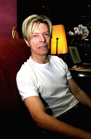 Singer David Bowie seen here relaxing in his Paris hotel room after performing in the concert in the French captial 
October 2003