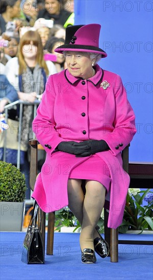 Queen Elizabeth II (R) and Catherine, Duchess of Cambridge (L) watch a fashion show at De Montfort University on March 8, 2012 in Leicester, England. The royal visit to Leicester marks the first date of Queen Elizabeth II's Diamond Jubilee tour of the UK.