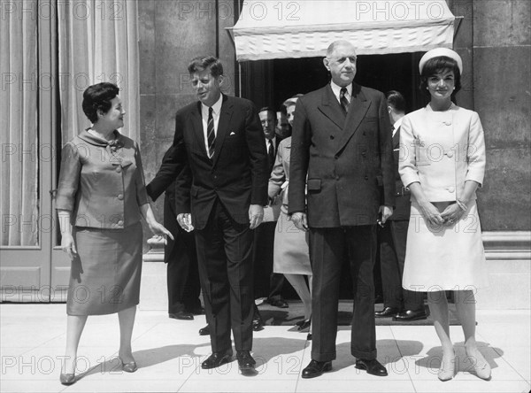 Visit of the American President John F Kennedy and his wife Jackie to Paris, France.
Picture shows: Yyvonne De Gaulle, President Kennedy, President Charles De Gaulle of France and the First Lady Jacqueline Kennedy standing together in Paris on the steps of the Elysee Palace.
31st May 1961.