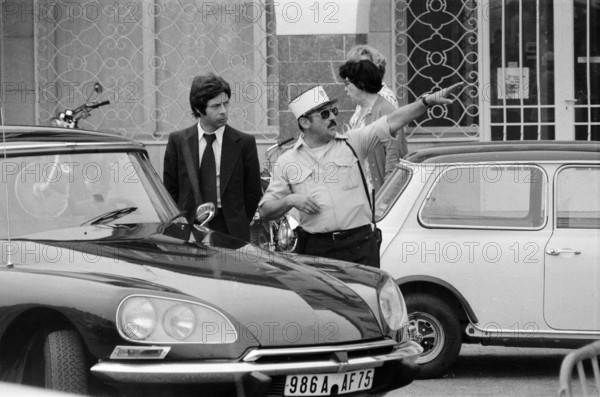 GV Saint-Tropez, France, Tuesday 17th June 1975, Police Officer giving directions.
Saint-Tropez is a coastal town on the French Riviera, South Eastern France.