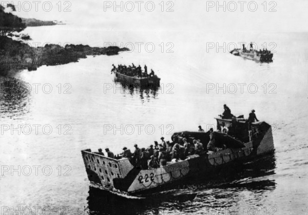 Picture taken six hours before the first Allied landings on the Southern Coast of France when commando troops captured the island known as the Ile Du Levant, just off the French mainland near Toulon.
Picture shows a Canadian landing craft slipping into an inlet on the island with supplies for the commandos.
August 1944.