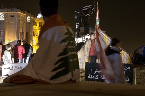 Lebanese protestors celebrate victory at Martyr's Square in Beirut