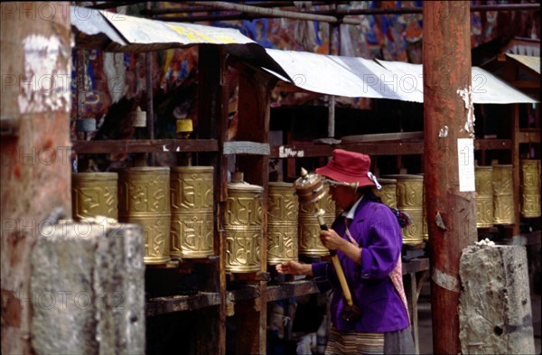 A Tibetan woman worshipping, Lhasa