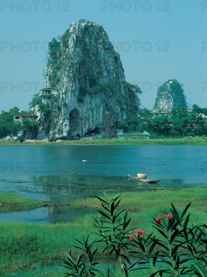 Cliff surrounded by water, China