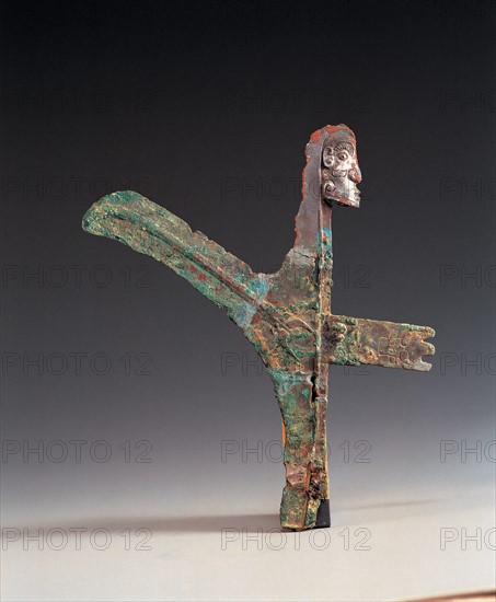 Bronze halberd with face shaped ornament